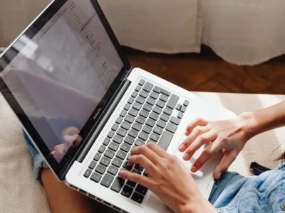 Person completing a paid online study survey on a laptop.