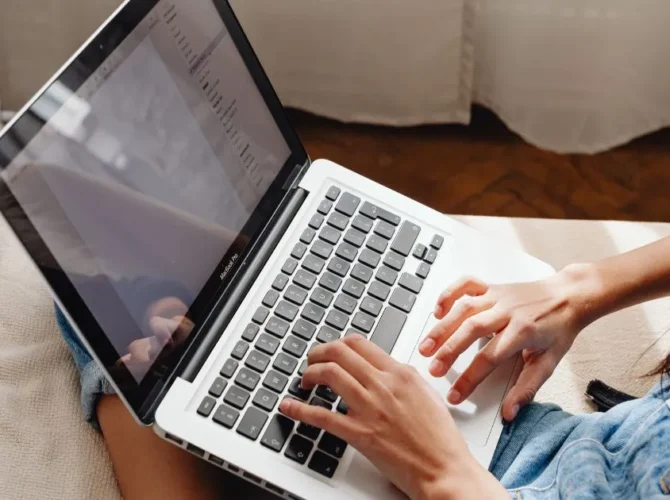Person completing a paid online study survey on a laptop.
