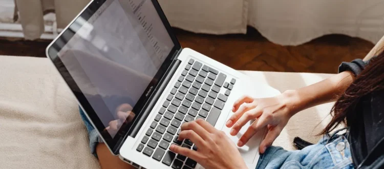 Person completing a paid online study survey on a laptop.